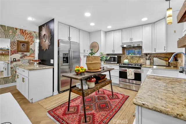 a bathroom with a toilet a sink and a shower