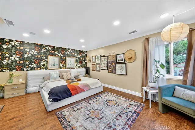 a bedroom with furniture and a window