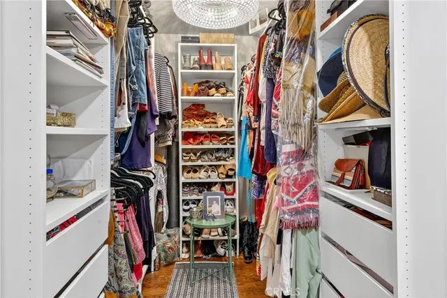 a kitchen with stainless steel appliances granite countertop a sink a refrigerator and cabinets