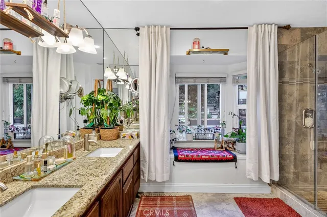 a view of a house with garden and sitting area