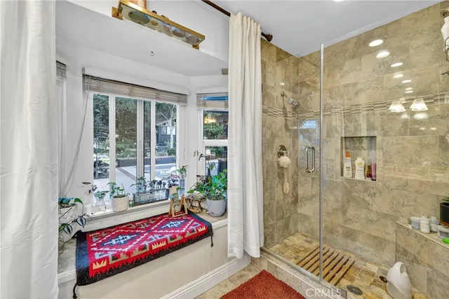 a view of a house with a yard patio and fire pit