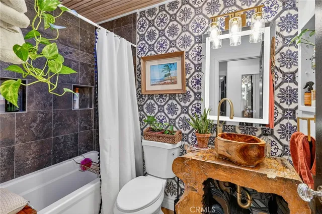 a view of an outdoor dining space with a table and chairs