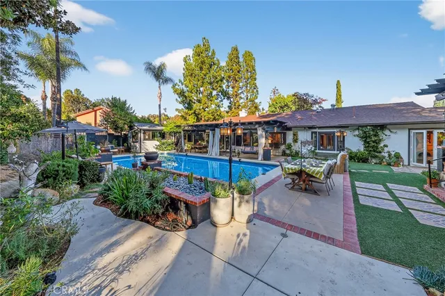 a view of a backyard with sitting area