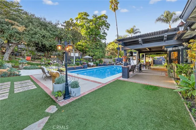 a living room with furniture a fireplace and a window