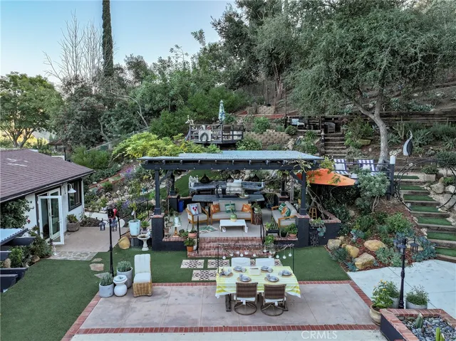 a view of a swimming pool with sitting area