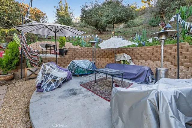 an aerial view of a house with a yard and garden
