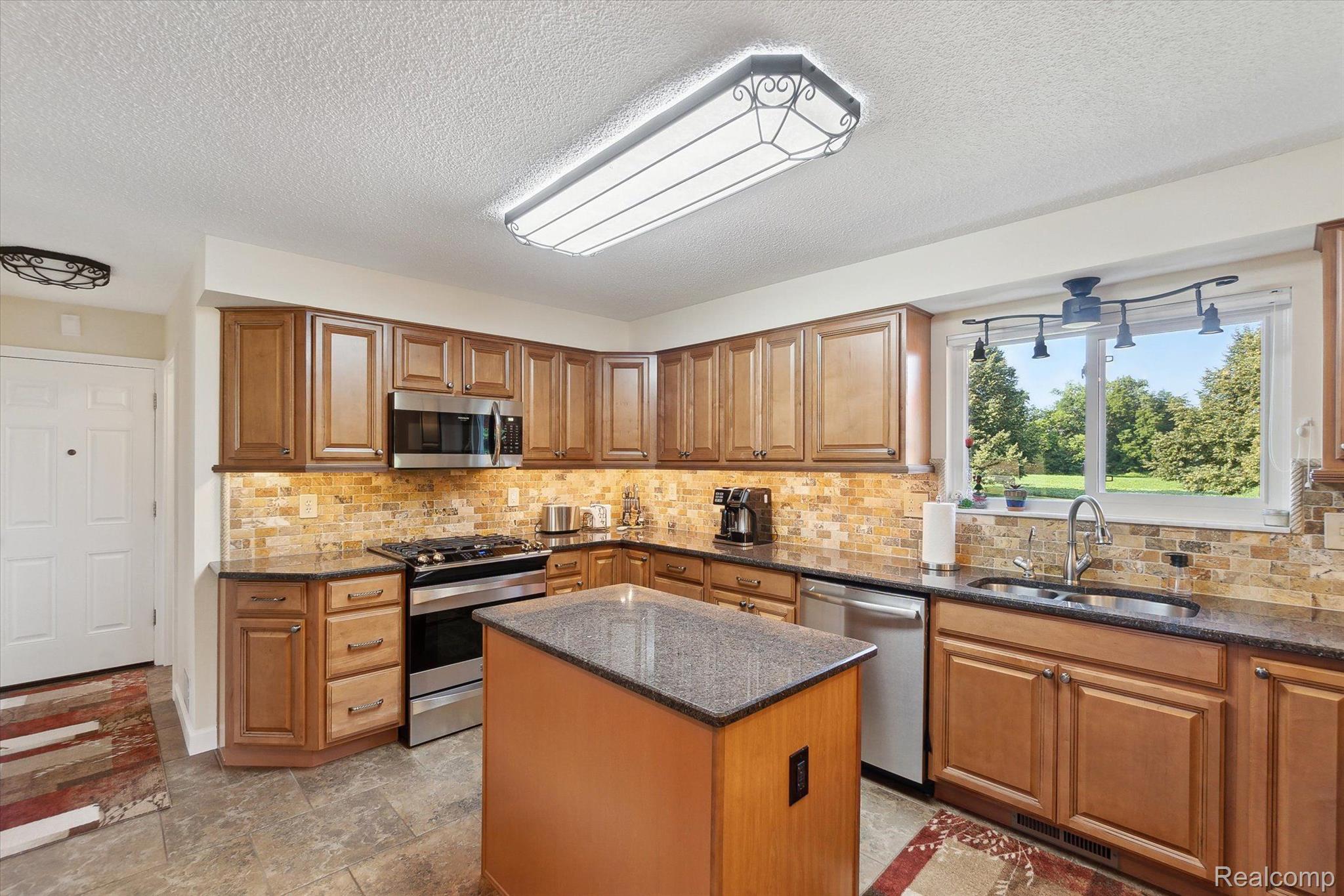 11811 Plank Road Milan, MI 48160 - Photo 12 of 46 Kitchen With Work Island