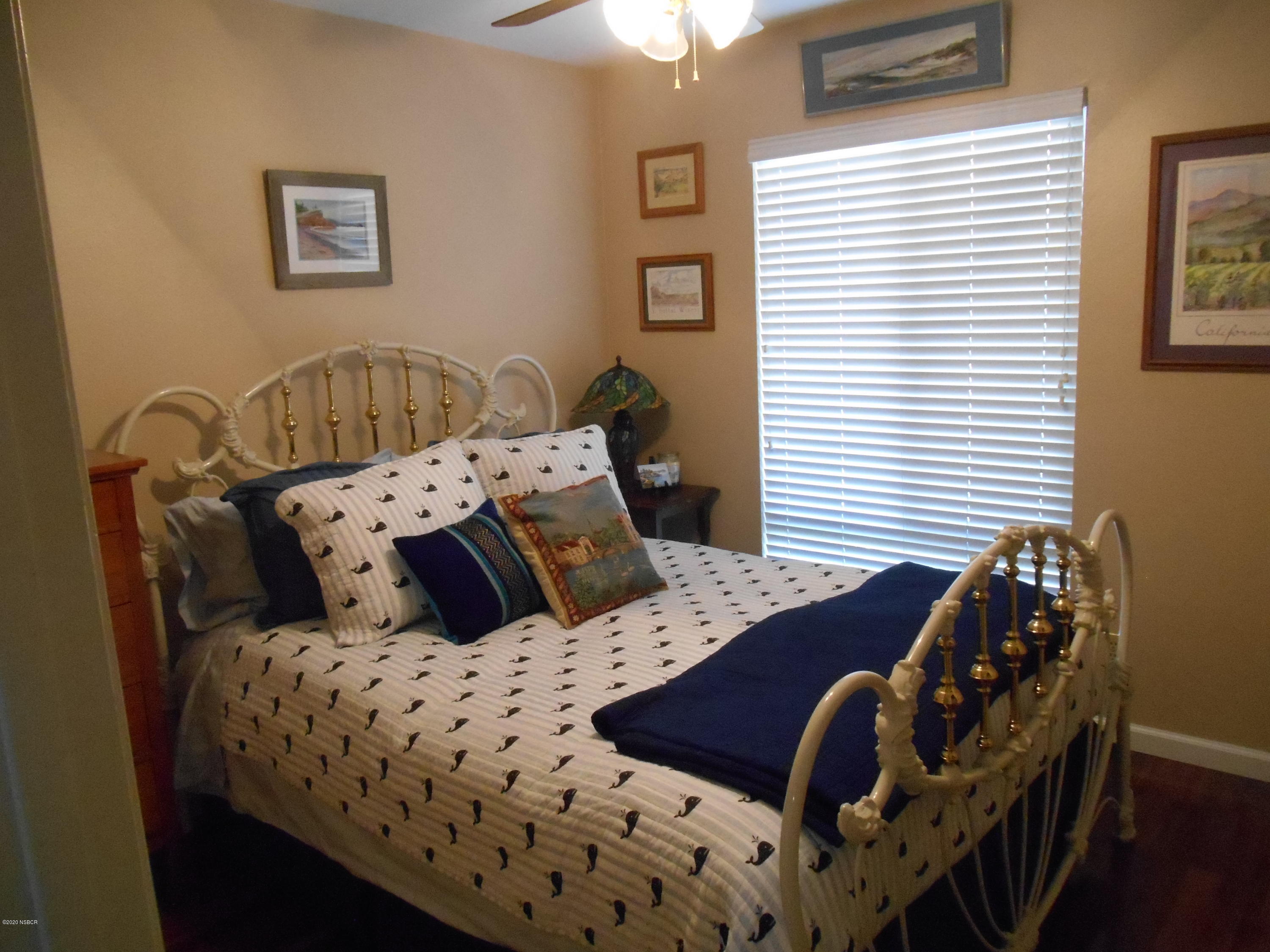 3941 Mesa Cir Drive Lompoc, CA 93436 - Photo 12 of 16 a bedroom with a bed and a table with window