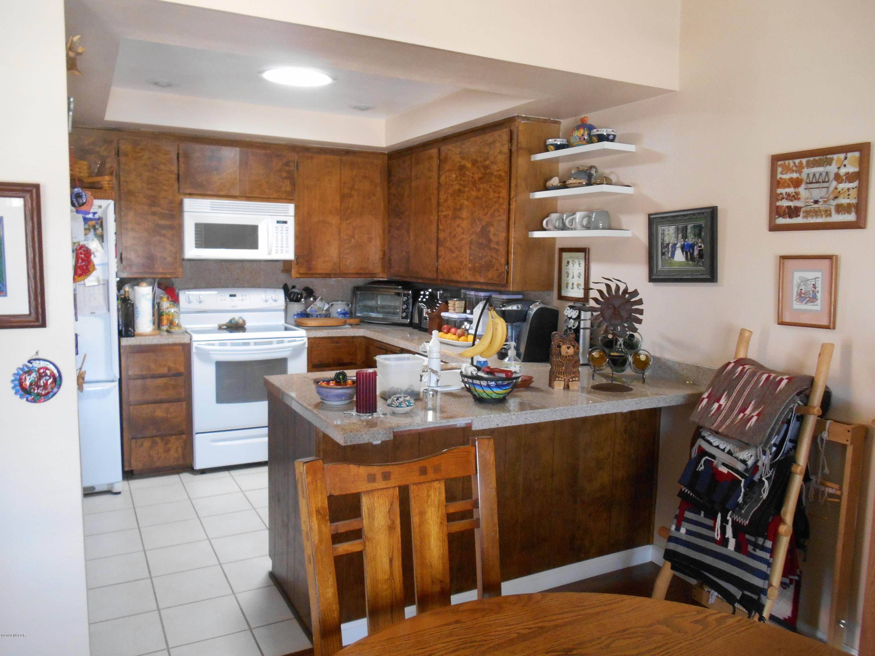 3941 Mesa Cir Drive Lompoc, CA 93436 - Photo 10 of 16 a kitchen with stainless steel appliances granite countertop a sink stove and cabinets
