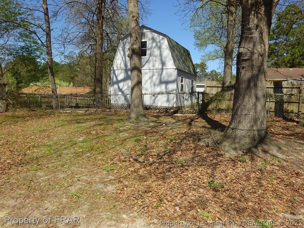 6528 Applewhite Road Fayetteville, NC 28304 - Photo 15 of 15 a view of backyard with tree