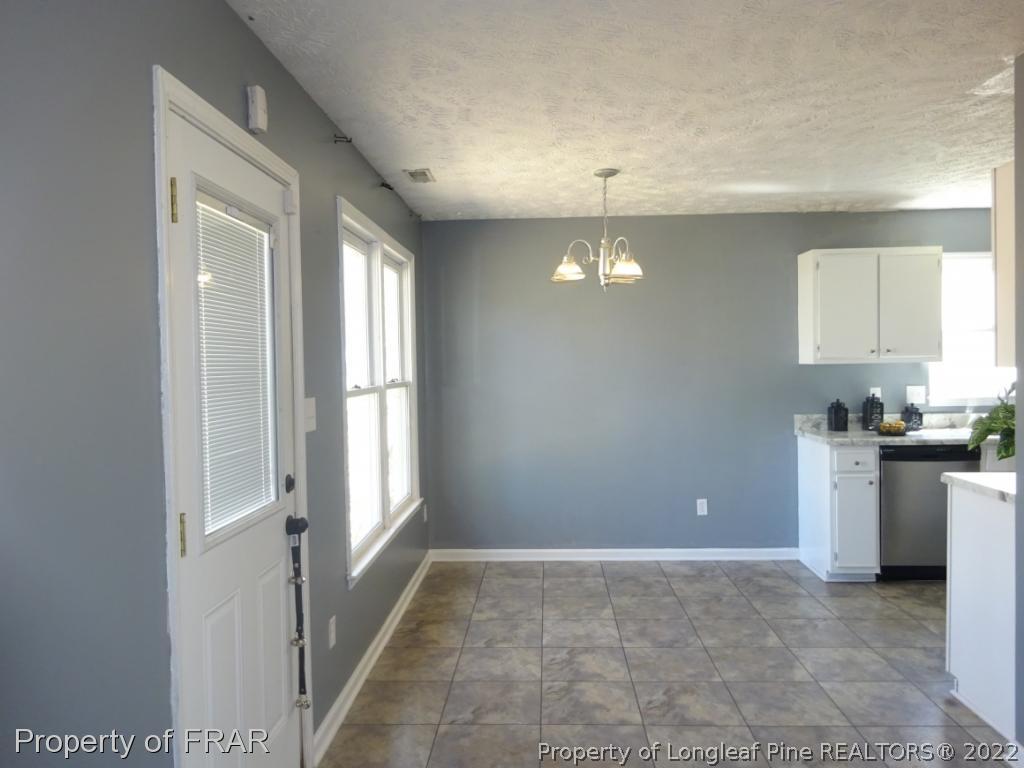 6528 Applewhite Road Fayetteville, NC 28304 - Photo 7 of 15 a view of a kitchen cabinets and a window