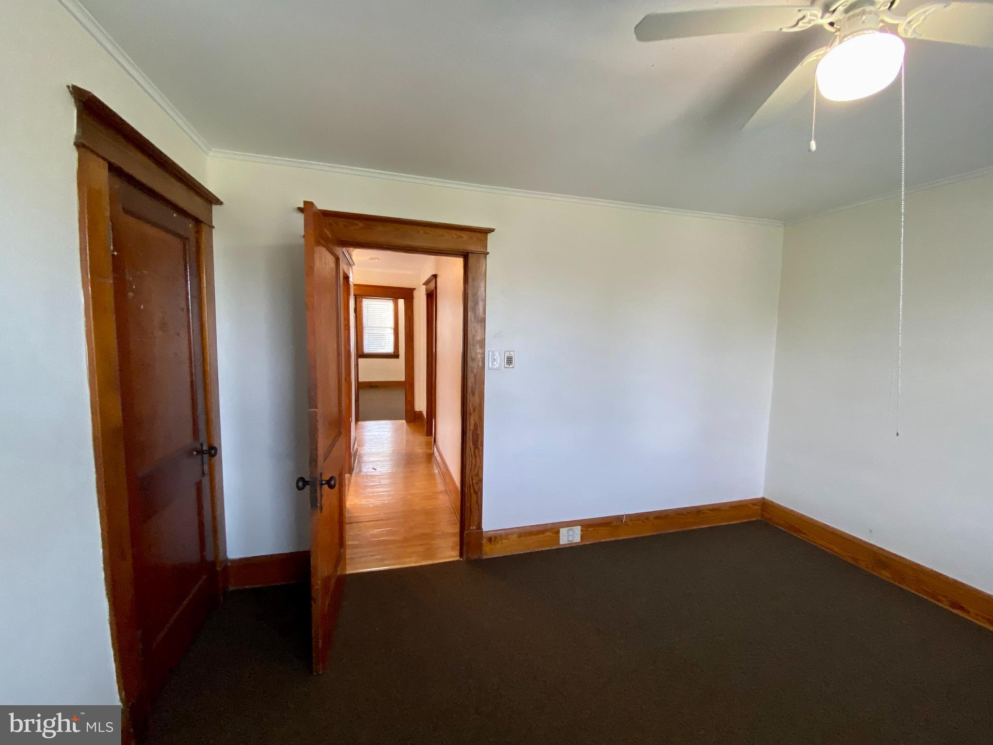 7003 Linden Avenue Baltimore, MD 21206 - Photo 14 of 29 a view of empty room with wooden floor