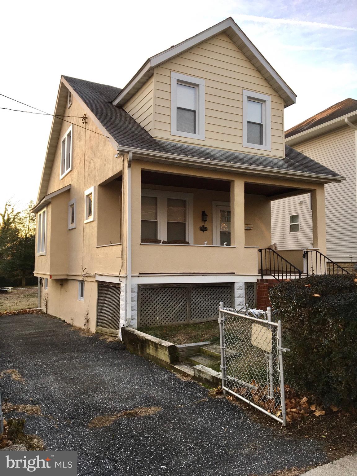 7003 Linden Avenue Baltimore, MD 21206 - Photo 2 of 29 a front view of a house with a garage