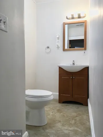 a view of washer and dryer with kitchen in the background