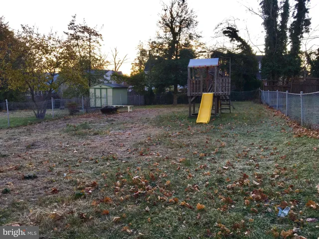 a white refrigerator freezer and a wooden floor
