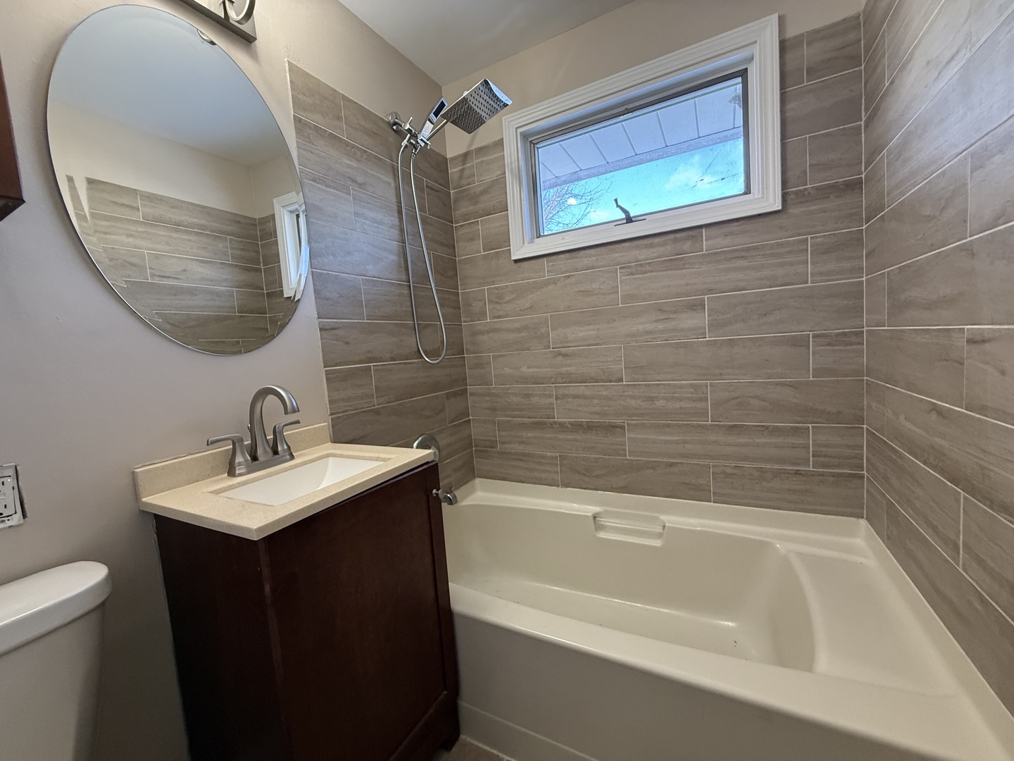 9060 South Main Street Hometown, IL 60456 - Photo 10 of 18 a bathroom with a sink and a mirror