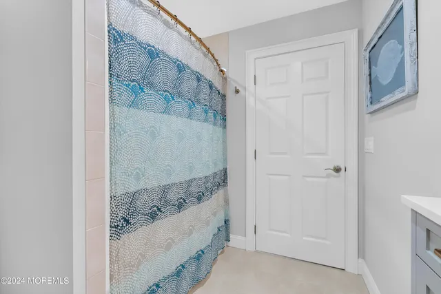 a bedroom with bed and window