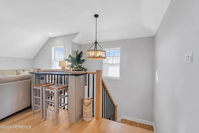 a bathroom with a toilet a sink and a mirror
