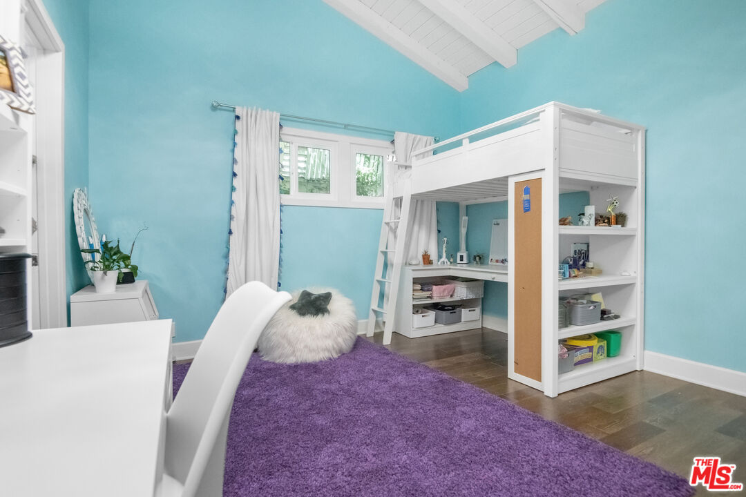 10353 Mississippi Avenue Los Angeles, CA 90025 - Photo 13 of 18 a living room with furniture and a dining table