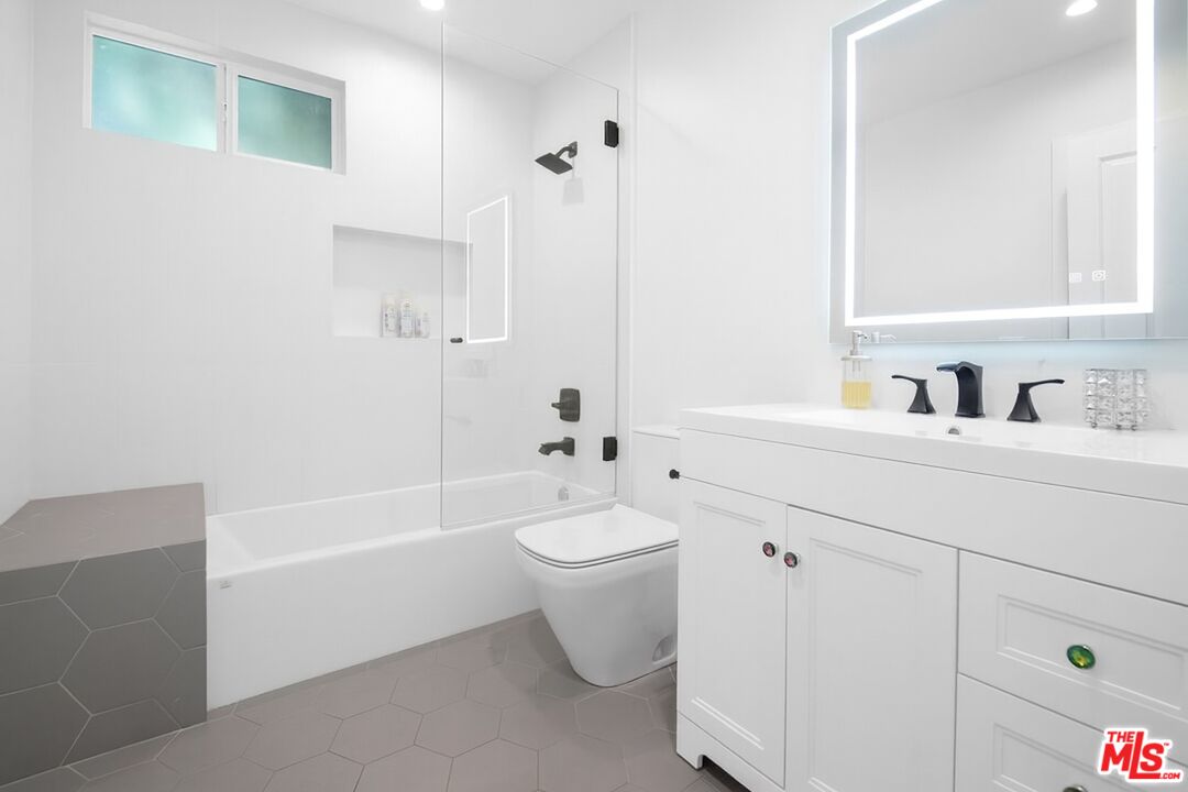 10353 Mississippi Avenue Los Angeles, CA 90025 - Photo 14 of 18 a bathroom with a sink a toilet and shower