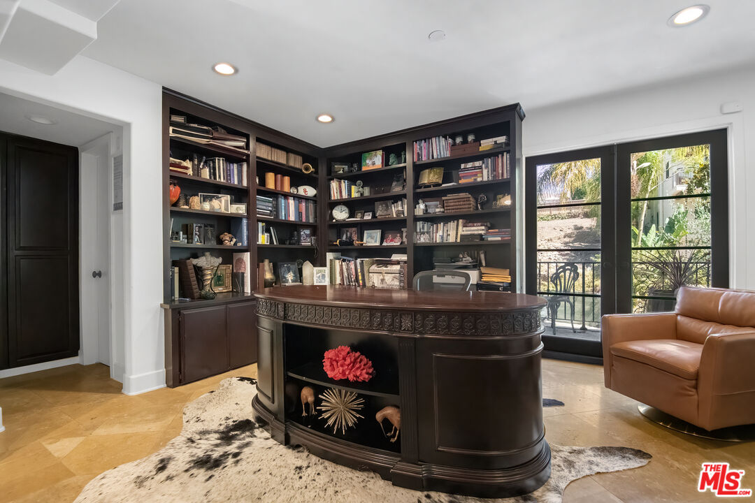 10353 Mississippi Avenue Los Angeles, CA 90025 - Photo 16 of 18 a living room with furniture and a fireplace