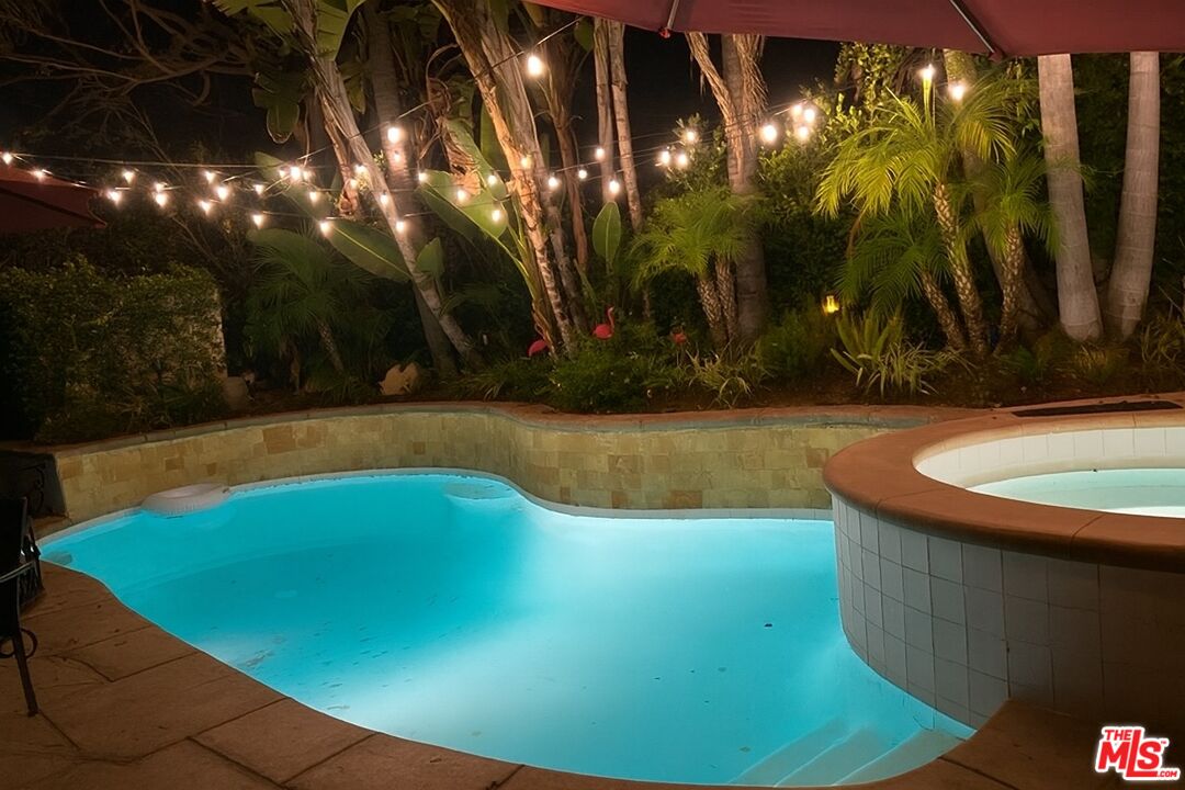 10353 Mississippi Avenue Los Angeles, CA 90025 - Photo 17 of 18 a view of a swimming pool with an outdoor space and seating area