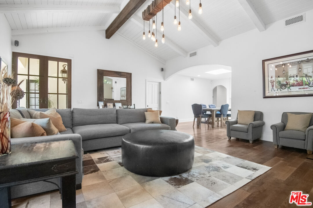 10353 Mississippi Avenue Los Angeles, CA 90025 - Photo 3 of 18 a living room with furniture and a chandelier