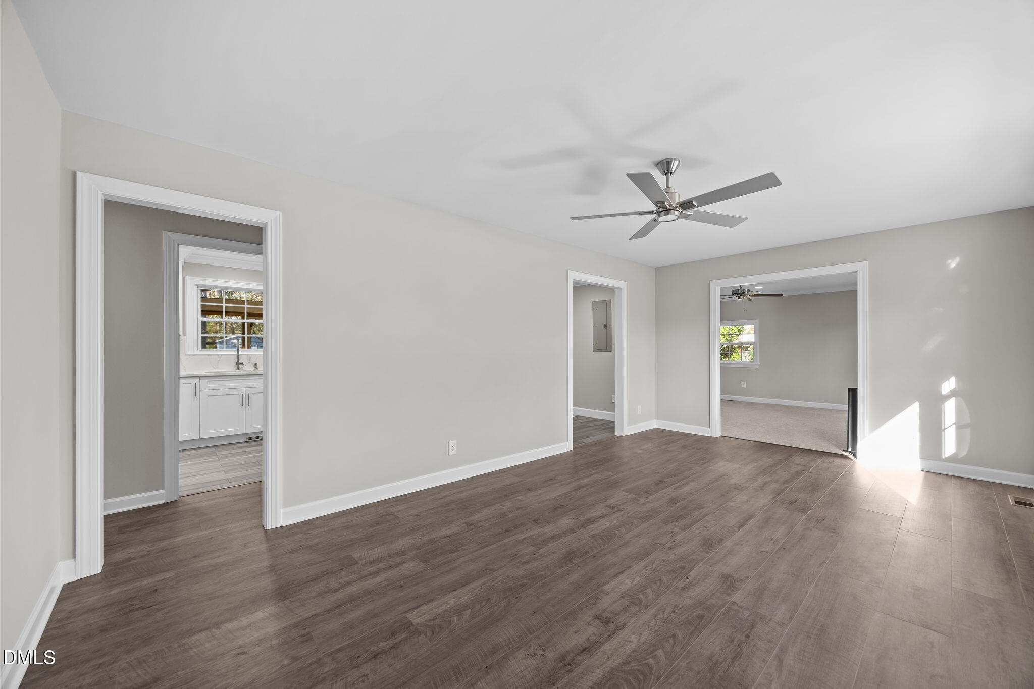 3009 Kenan Road Durham, NC 27704 - Photo 12 of 24 a view of a livingroom with wooden floor and a ceiling fan