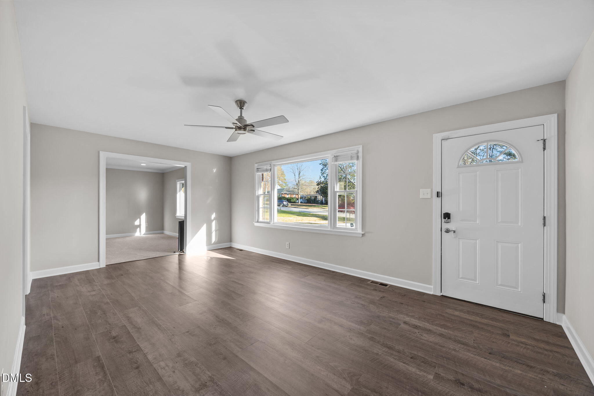 3009 Kenan Road Durham, NC 27704 - Photo 13 of 24 a view of an empty room with a window and wooden floor