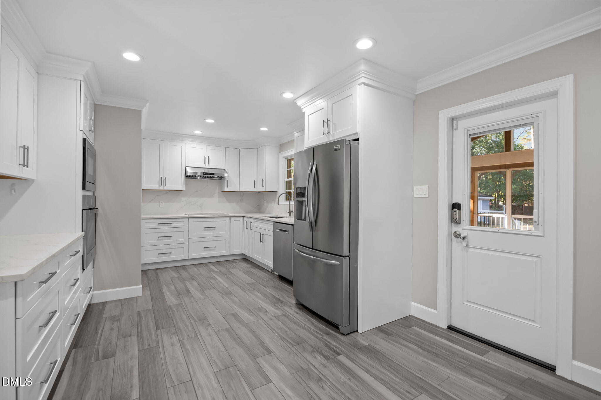 3009 Kenan Road Durham, NC 27704 - Photo 16 of 24 a kitchen with stainless steel appliances a refrigerator sink and microwave