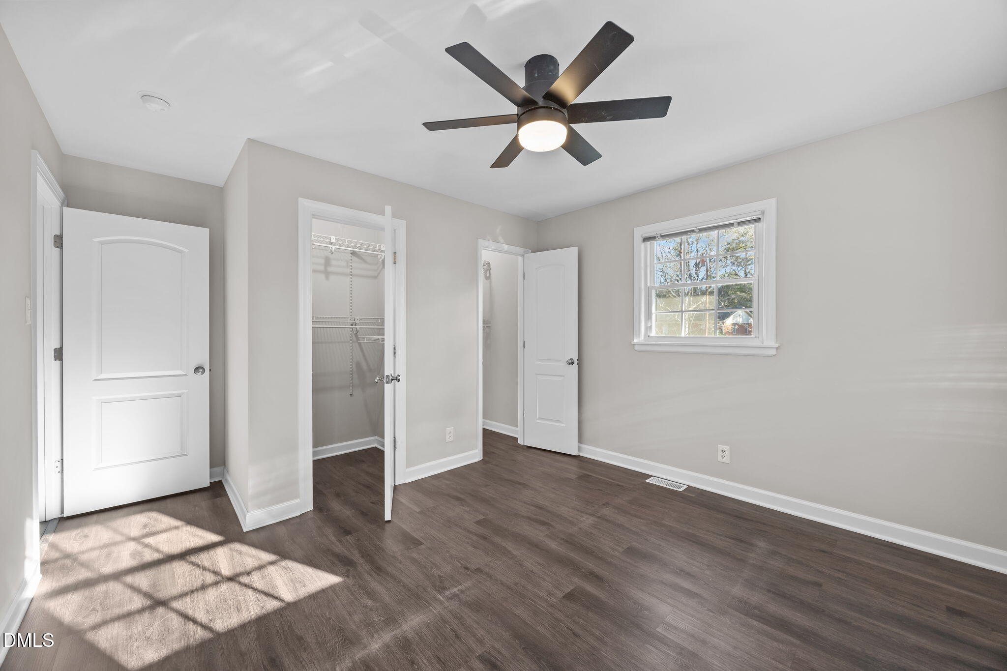 3009 Kenan Road Durham, NC 27704 - Photo 21 of 24 a view of a livingroom with wooden floor and a ceiling fan