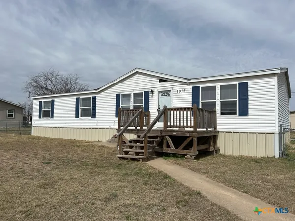 a house with a bench in front of it