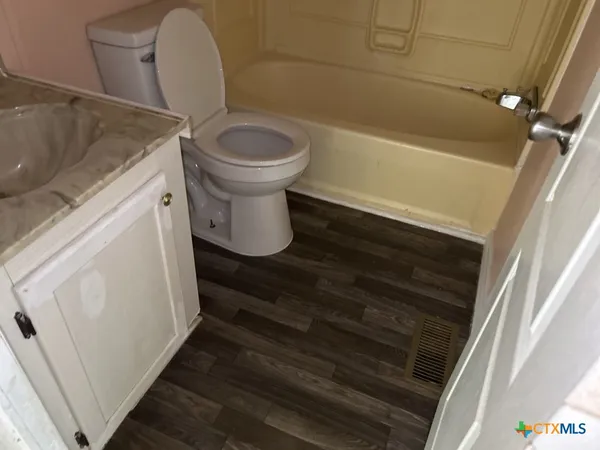 a bathroom with a sink and a toilet