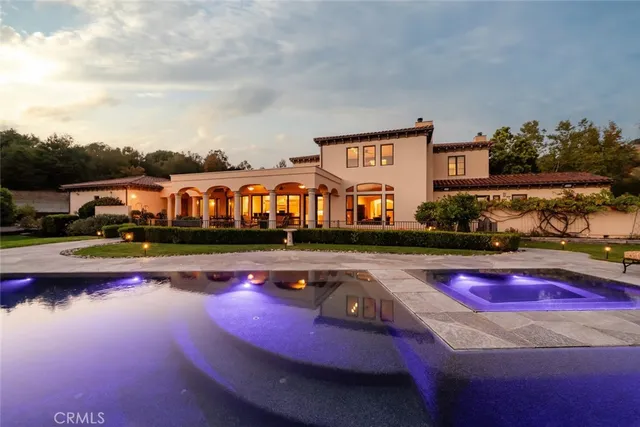 a living room with furniture a rug and a flat screen tv