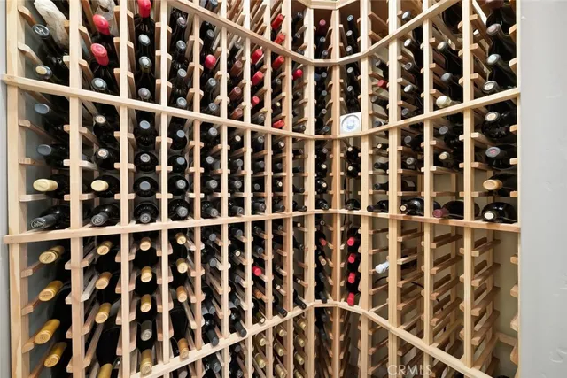 an aerial view of a house with a yard and swimming pool