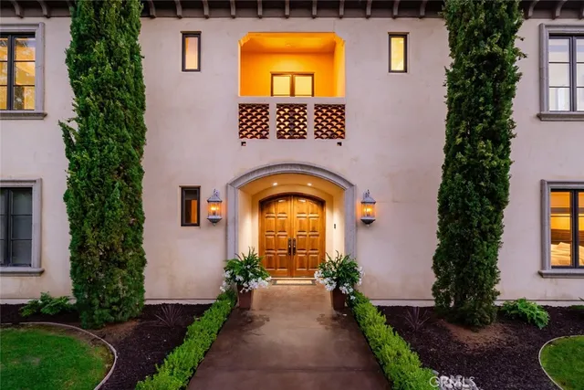 a view of a patio with a table chairs and a backyard