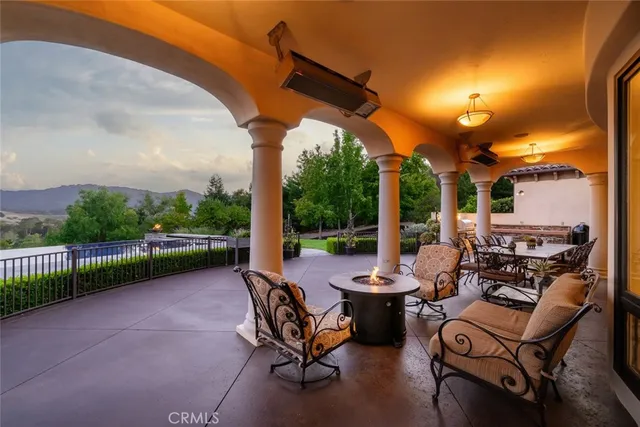 a spacious bedroom with a large bed and a potted plant