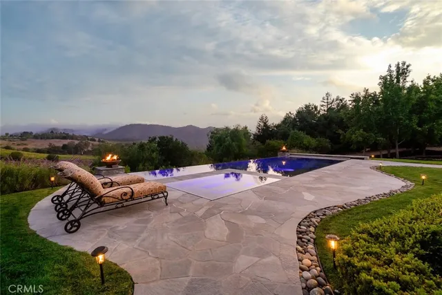 a bathroom with a window and a shower