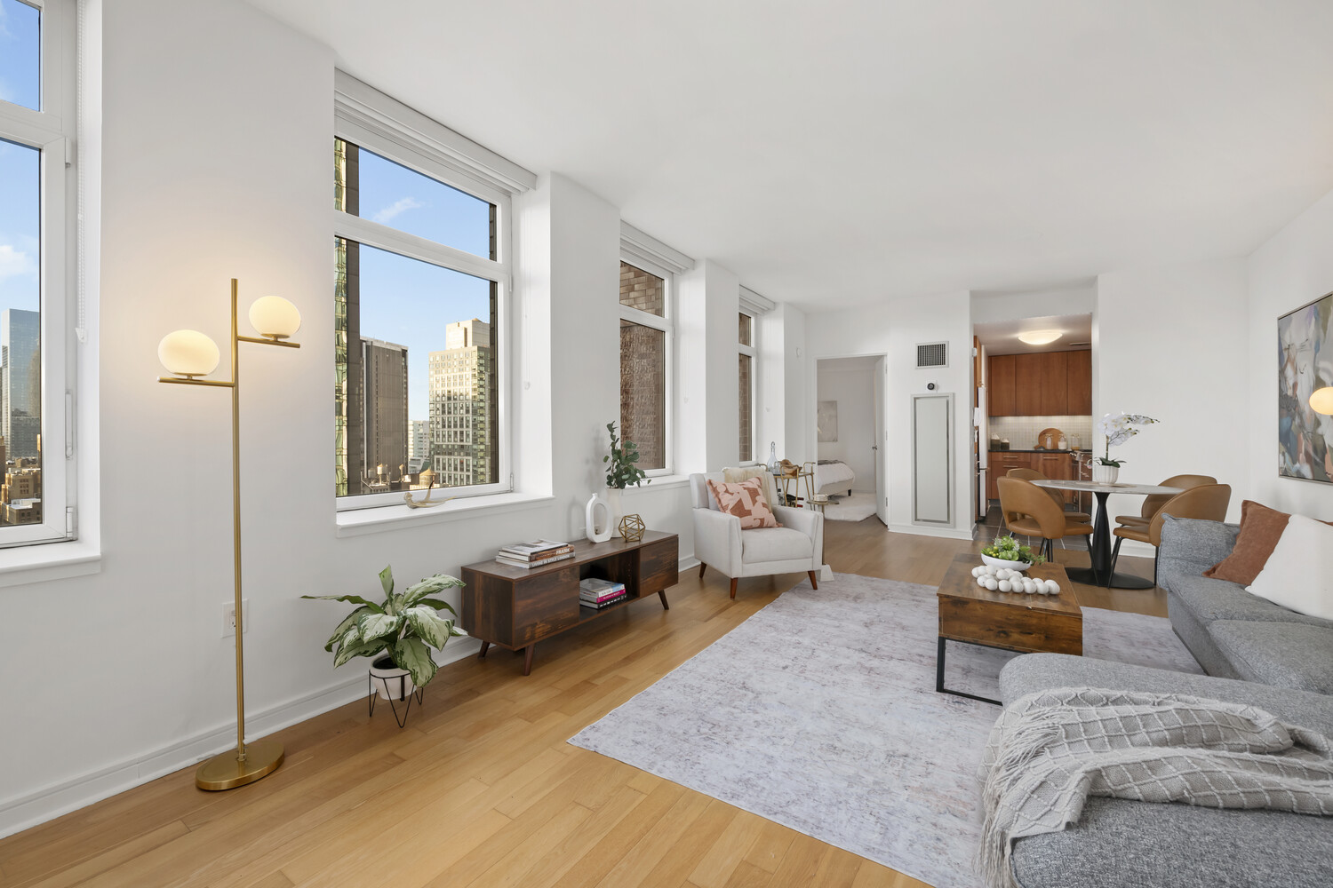 11 East 29th Street, Unit 30B Manhattan, NY 10016 - Photo 2 of 9 a living room with furniture and a potted plant