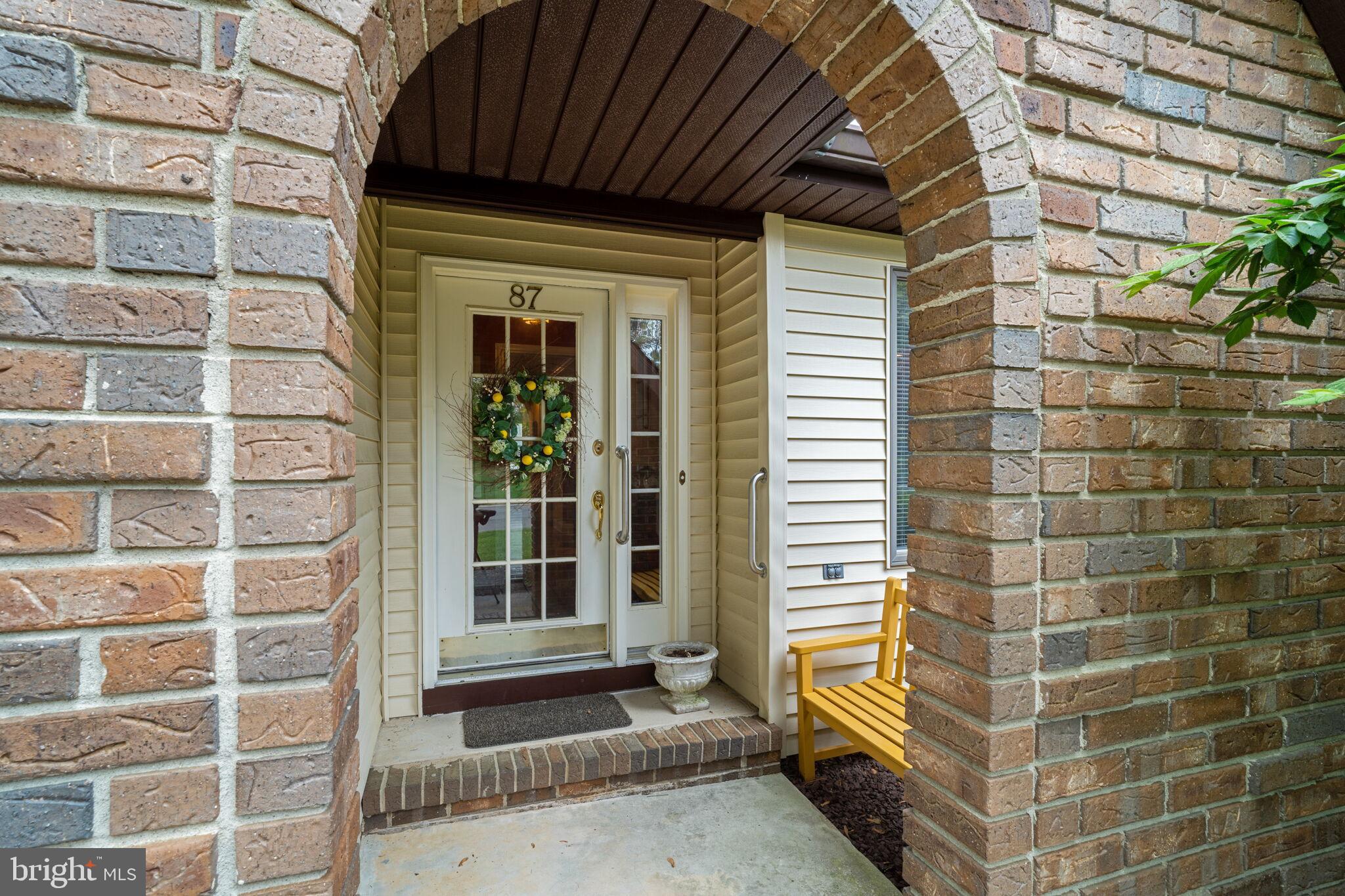 87 Ash Road Manahawkin, NJ 08050 - Photo 6 of 27 a view of a brick house with a door and wooden floor