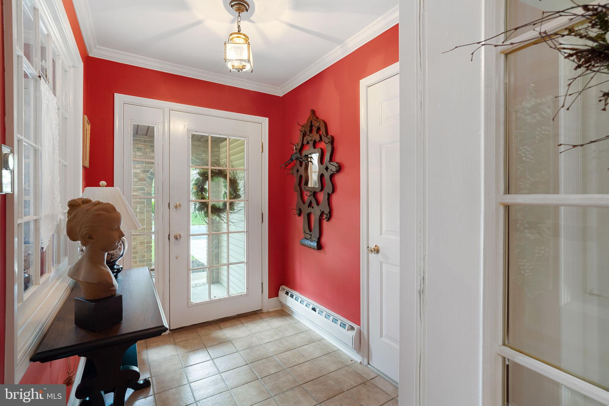 87 Ash Road Manahawkin, NJ 08050 - Photo 8 of 27 a view of hallway with chandelier