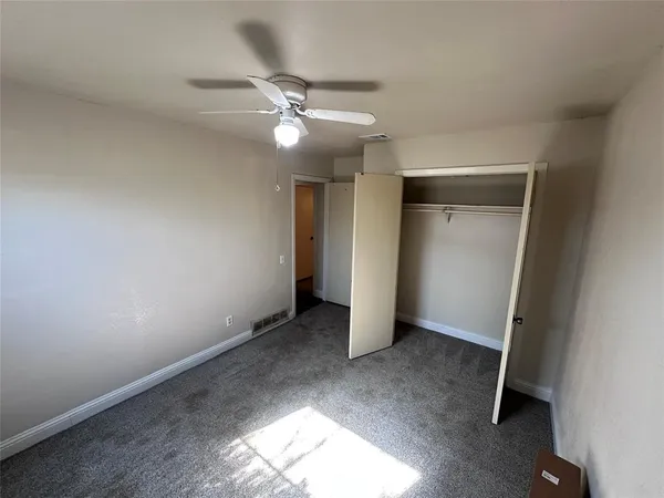 a bathroom with a double vanity sink toilet and shower