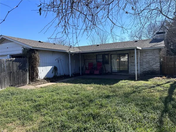 a view of a backyard with a swing