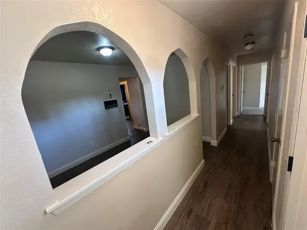 a kitchen with a sink a counter top space and a window
