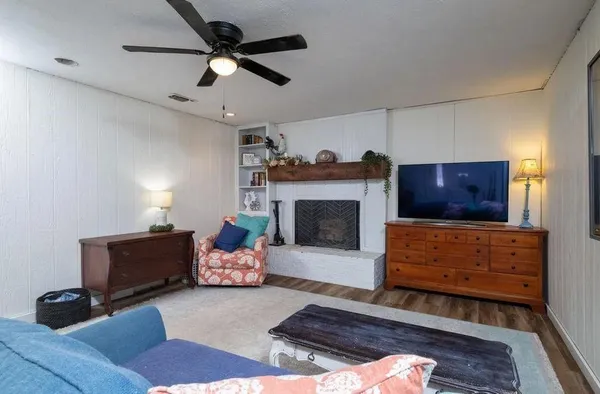 a living room with furniture and a fireplace