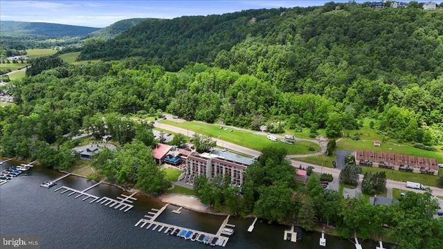 an aerial view of house with yard swimming pool and outdoor seating