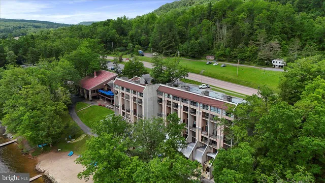a view of a chairs and table in backyard of the house