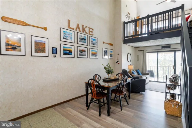 a view of a livingroom with furniture window and wooden floor