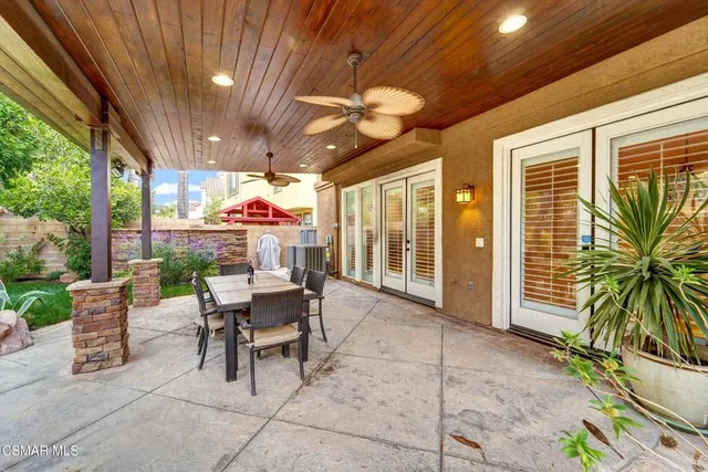 a view of a swimming pool with a patio