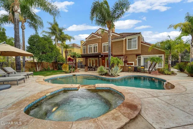 a view of a swimming pool with a patio